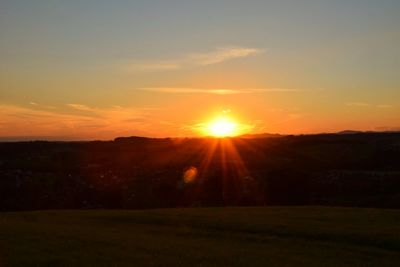 Scenic view of landscape at sunset