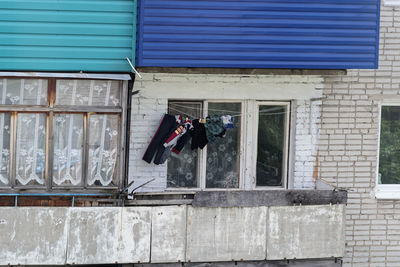 Clothes drying against wall of building