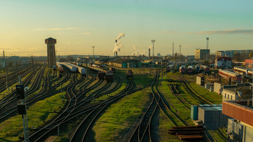 High angle view of railroad tracks against sky during sunset