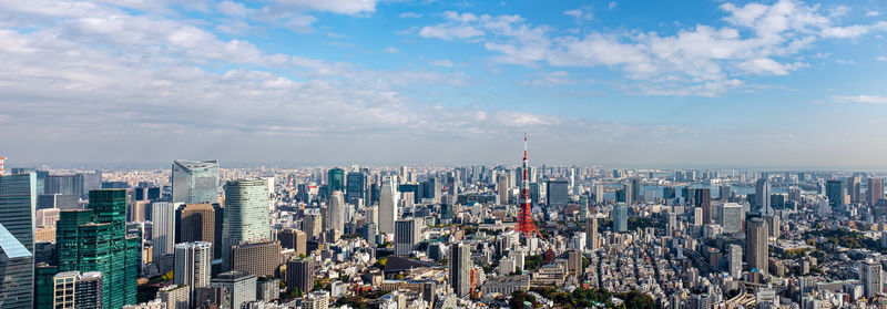 Aerial view of modern buildings in city against sky