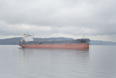 View of ship in sea against sky