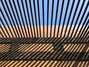 High angle view of shadow on footpath during sunny day