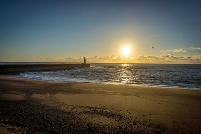 Scenic view of sea at sunset