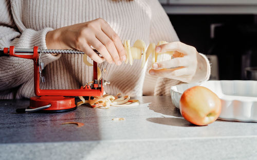 Midsection of woman preparing food