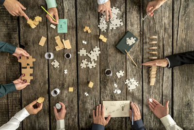 High angle view of people playing on table