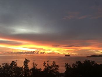 Scenic view of sea against orange sky