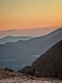 Scenic view of mountains against sky during sunset