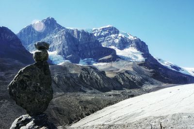 Scenic view of snowcapped mountains against clear sky