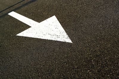 Arrow symbol on road in city