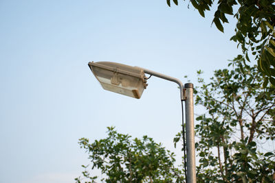 Low angle view of street light against sky