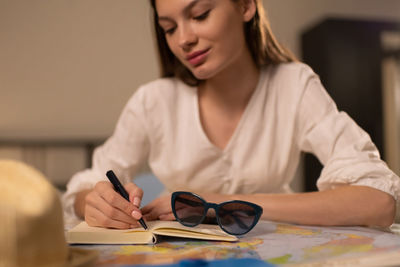 Young woman using laptop on table