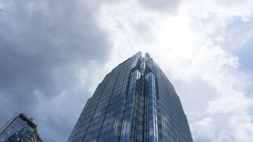 Low angle view of skyscraper against sky