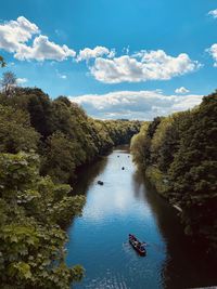 Durham city in june 2021. a high angle view of river amidst trees against sky. camera is iphone 11.