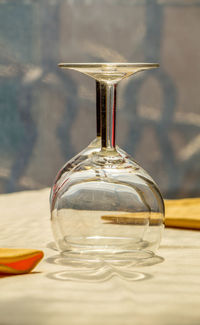 Close-up of wine in glass bottle on table