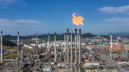 Aerial top view oil and gas refinery petrochemical plant industrial with oil and gas storage tank.