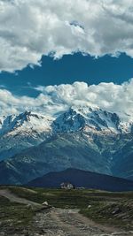 Scenic view of snowcapped mountains against sky