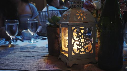 Close-up of lantern on table at restaurant