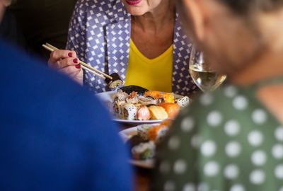 Midsection of woman holding ice cream