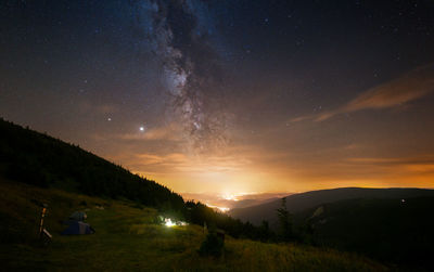 Milky way above the city lights seen from the mountain