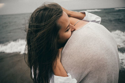 Portrait of young woman at beach