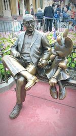 Man sitting on statue