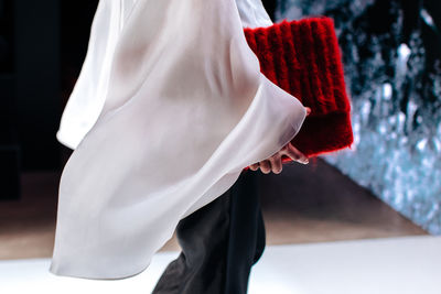 Low section of woman wearing wedding dress