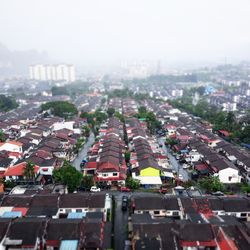 High angle view of traffic on street amidst buildings in city