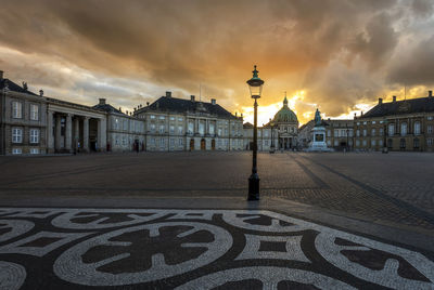 Amalienborg castle in central copenhagen with frederik's church behind. seen at sunset