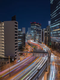 High angle view of light trails on road at night