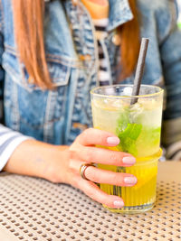 Close-up of woman holding drink