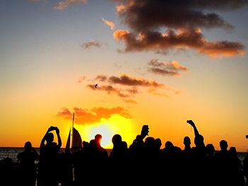 Silhouette people at sunset