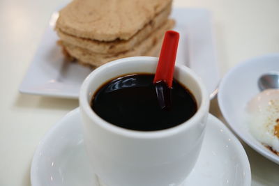 Close-up of coffee cup on table