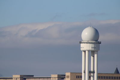 Low angle view of radar tower against sky