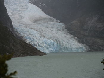 Scenic view of sea against mountain