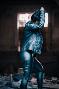 Side view of woman standing outdoors