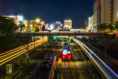 High angle view of light trails on road at night