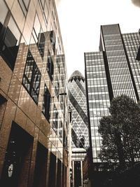 Low angle view of modern buildings against sky