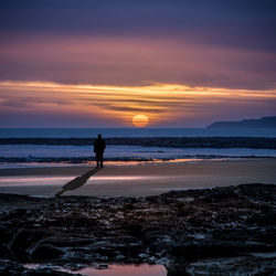 Scenic view of sea at sunset