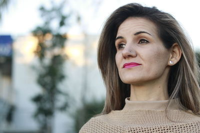 Close-up portrait of woman in winter