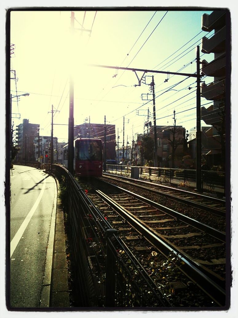 railroad track, rail transportation, transportation, public transportation, railroad station platform, railroad station, built structure, architecture, diminishing perspective, sky, the way forward, railway track, train - vehicle, transfer print, vanishing point, building exterior, travel, city, clear sky, auto post production filter