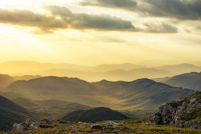 Scenic view of mountains against sky during sunset