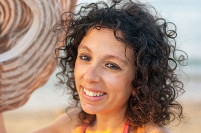 Smiling young woman wearing hat 