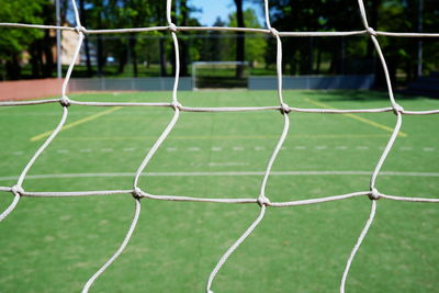 Close-up of net at soccer field