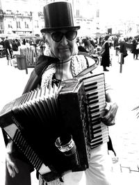 Midsection of man wearing music concert