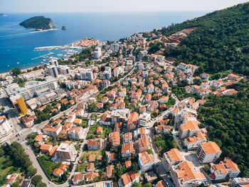 High angle view of townscape by sea