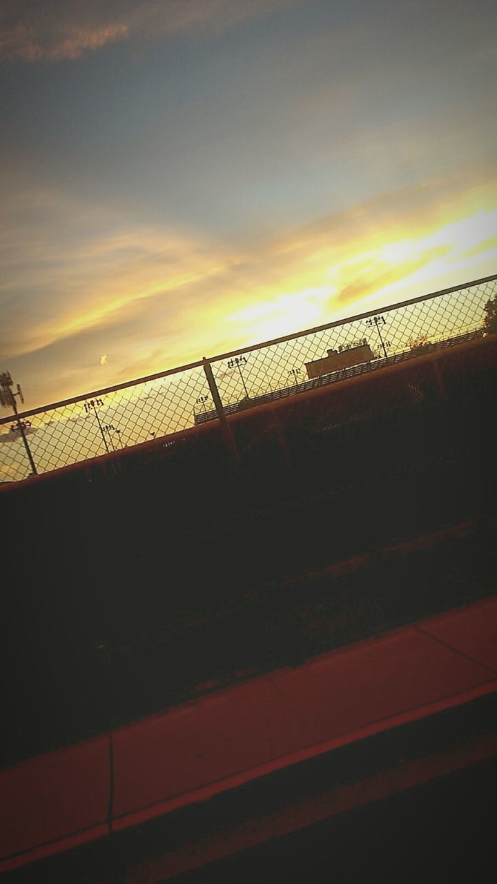 SILHOUETTE FENCE AGAINST SKY DURING SUNSET