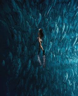 Side view of woman swimming in sea