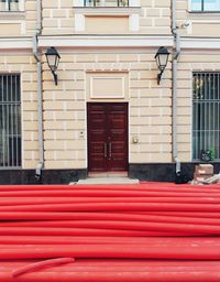 Red closed door of building