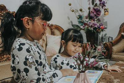 Girl and woman are studying at home