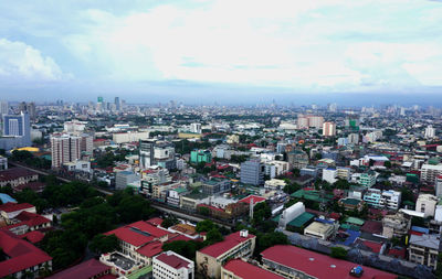 High angle view of buildings in city against sky